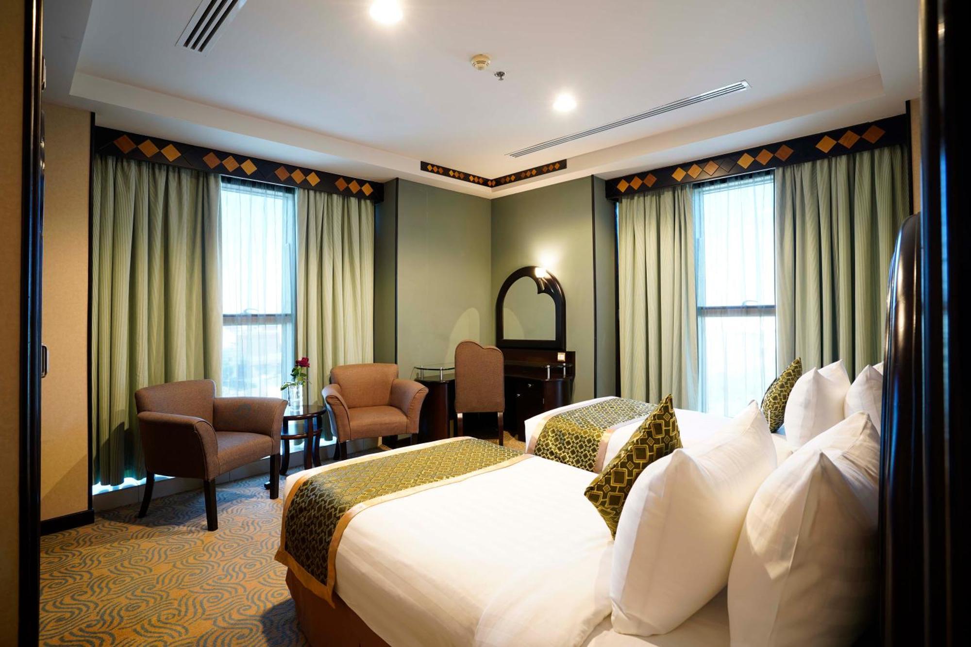 Awaliv International Hotel Ta'if Kamer foto A bedroom at the hotel